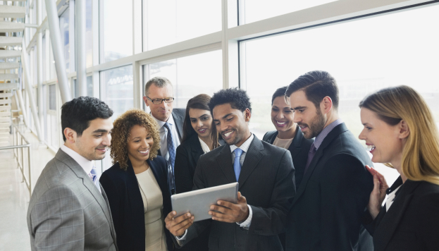 Diverse group of Convention Attendees enjoying HSIA and IoT integration in a smart convention center