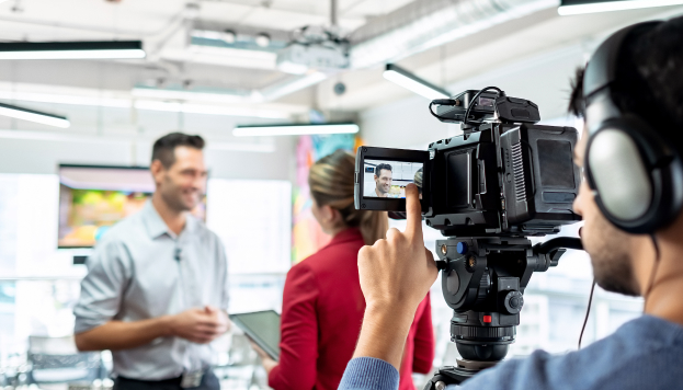 Camera Man filming hybrid event at Convention Center using scalable, high-speed internet bandwidth